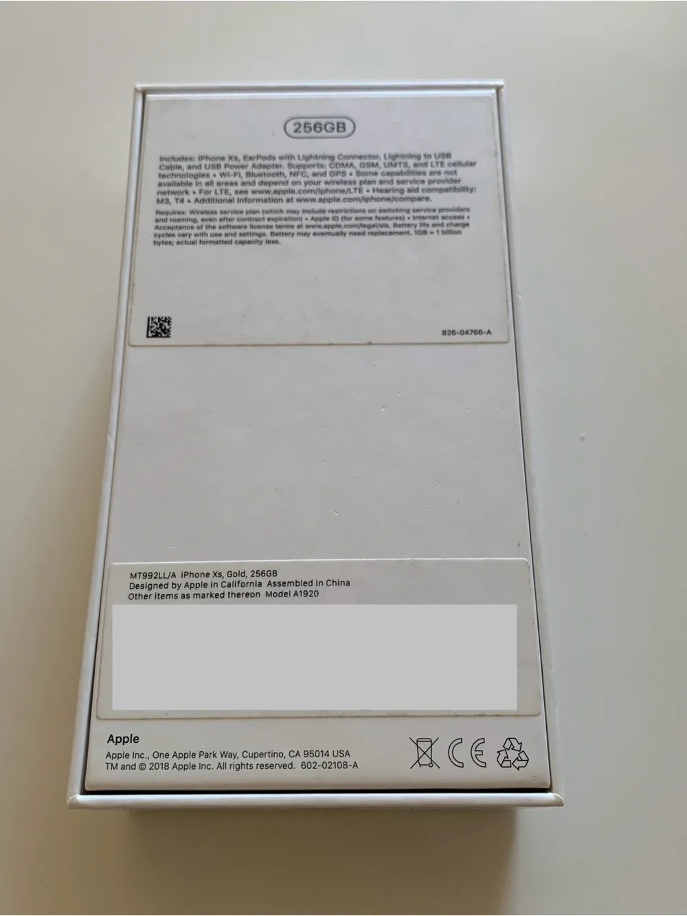 Empty iPhone Xs Gold Box and Apple Stickers